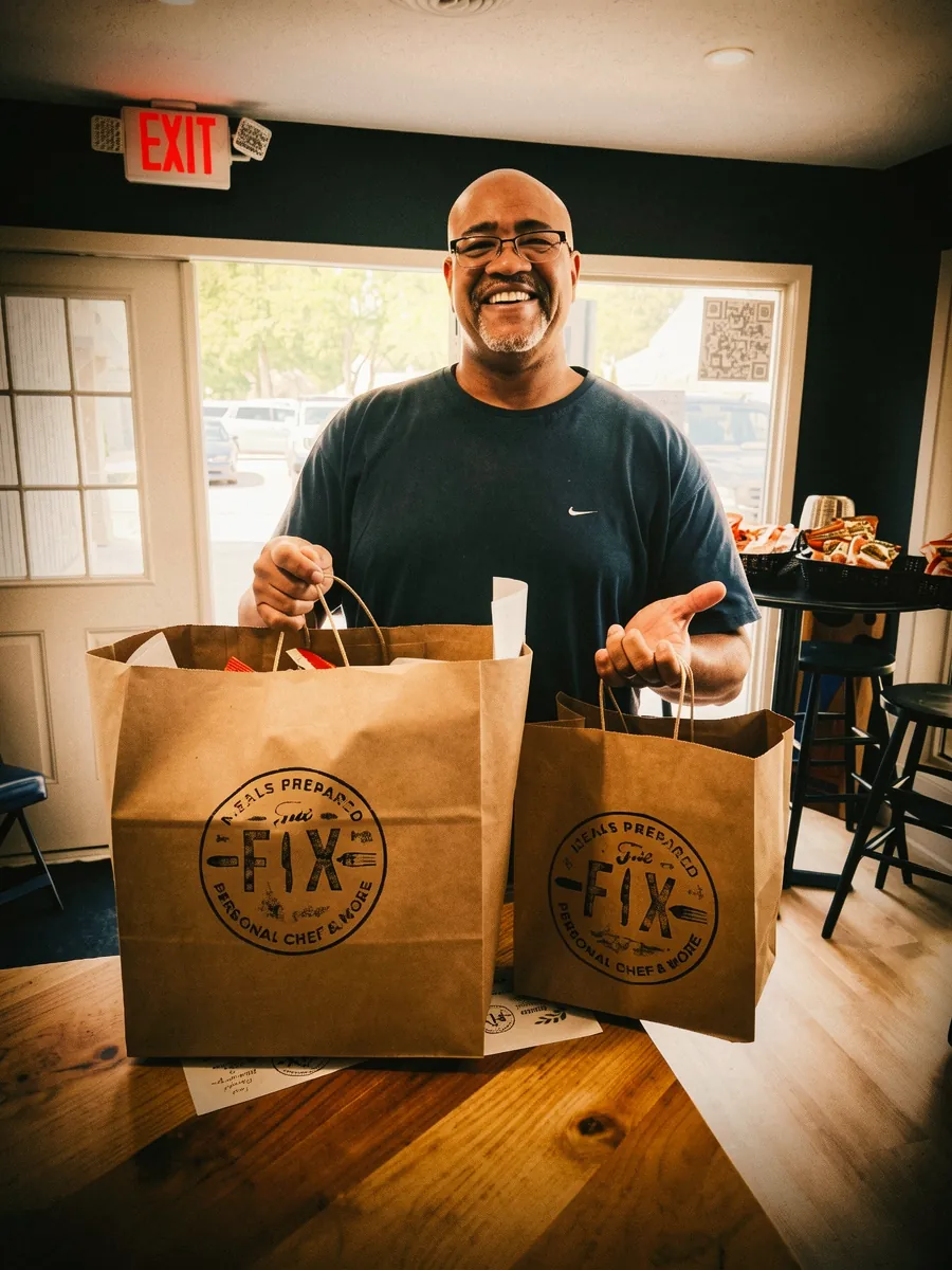 A customer picking up their branded The Fix bags